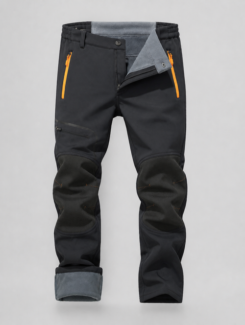 Softshell ski pants with waistband and hem folded to show the fleece lining